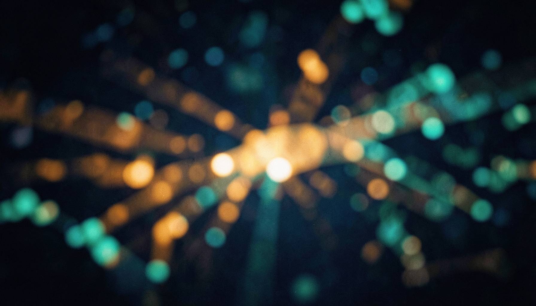 Warm amber and teal abstract light patterns suggesting global music connections